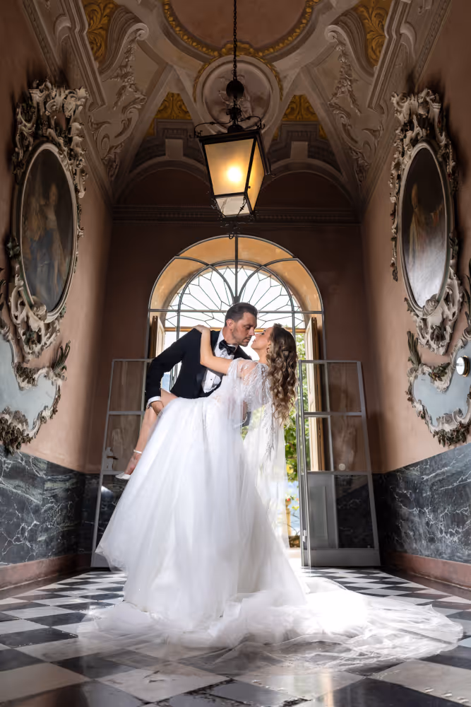 Wedding in Greece, Santorini. Young couple embracing and kissing after the wedding ceremony.