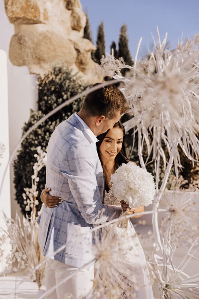 Wedding in Greece. Mykonos. A young couple embracing.