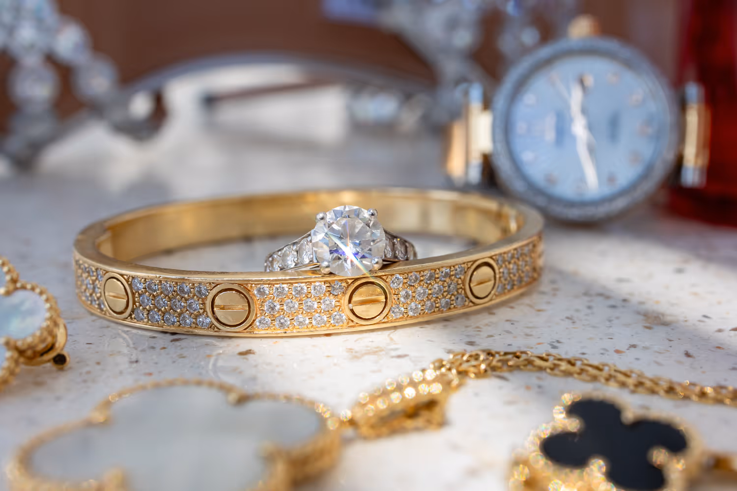 Wedding in Greece, Santorini. Photo of a gold bracelet with an engagement ring.