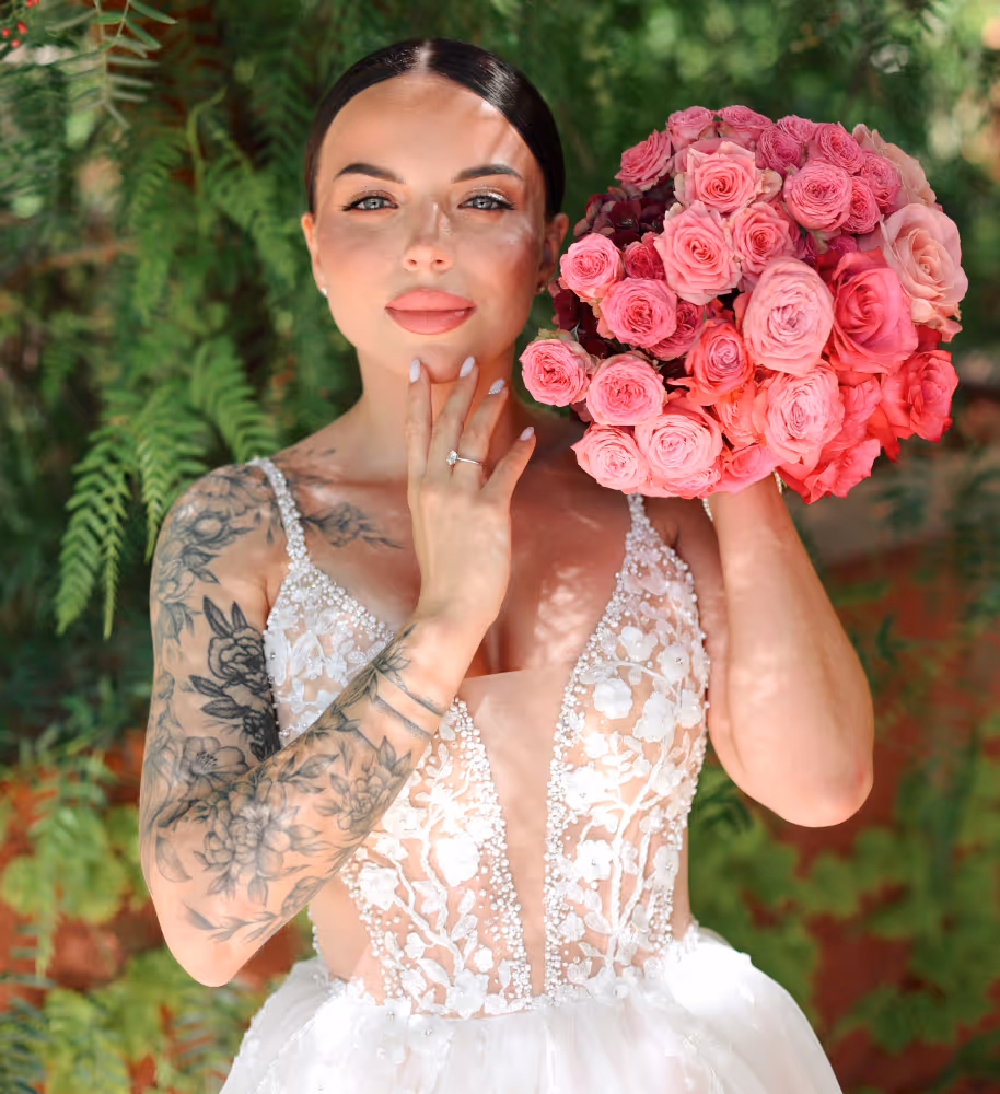 Wedding in Spain. Peralada. A shot of the bride in a wedding dress holding a bouquet of flowers