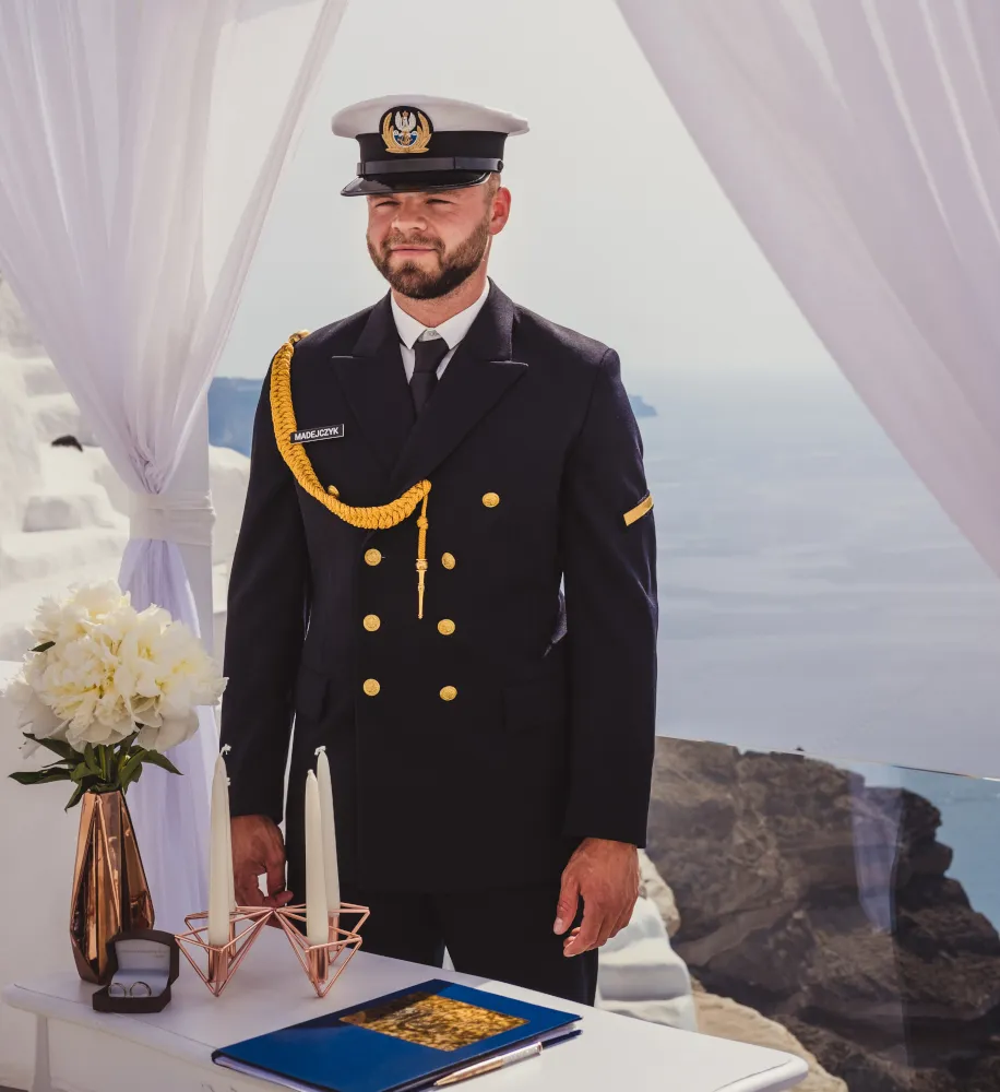 A wedding in Greece. Santorini. A shot of the groom in a military suit. 