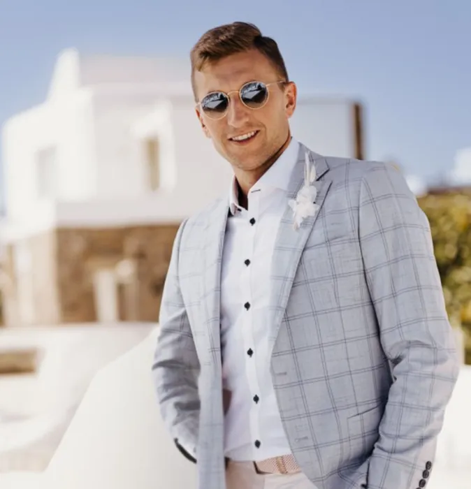 A wedding at the Wieliczka Salt Mine, Poland. A shot of the groom in his wedding suit.