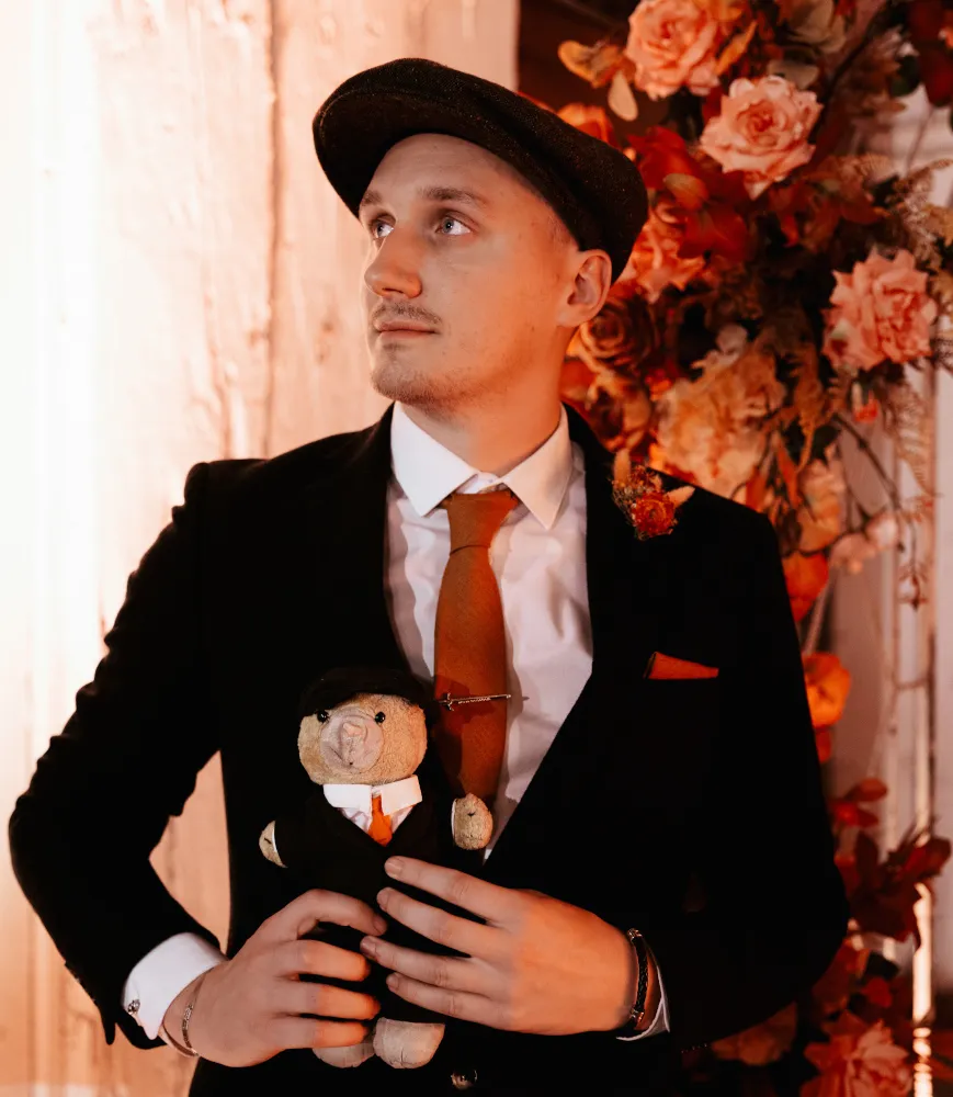 A wedding at the Wieliczka Salt Mine, Poland. A shot of the groom in his wedding suit.