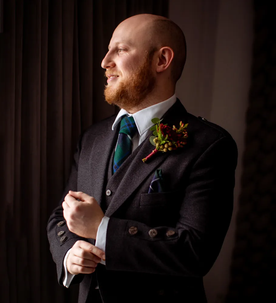A wedding in Zakopane. Poland. A shot of the groom in his wedding suit.