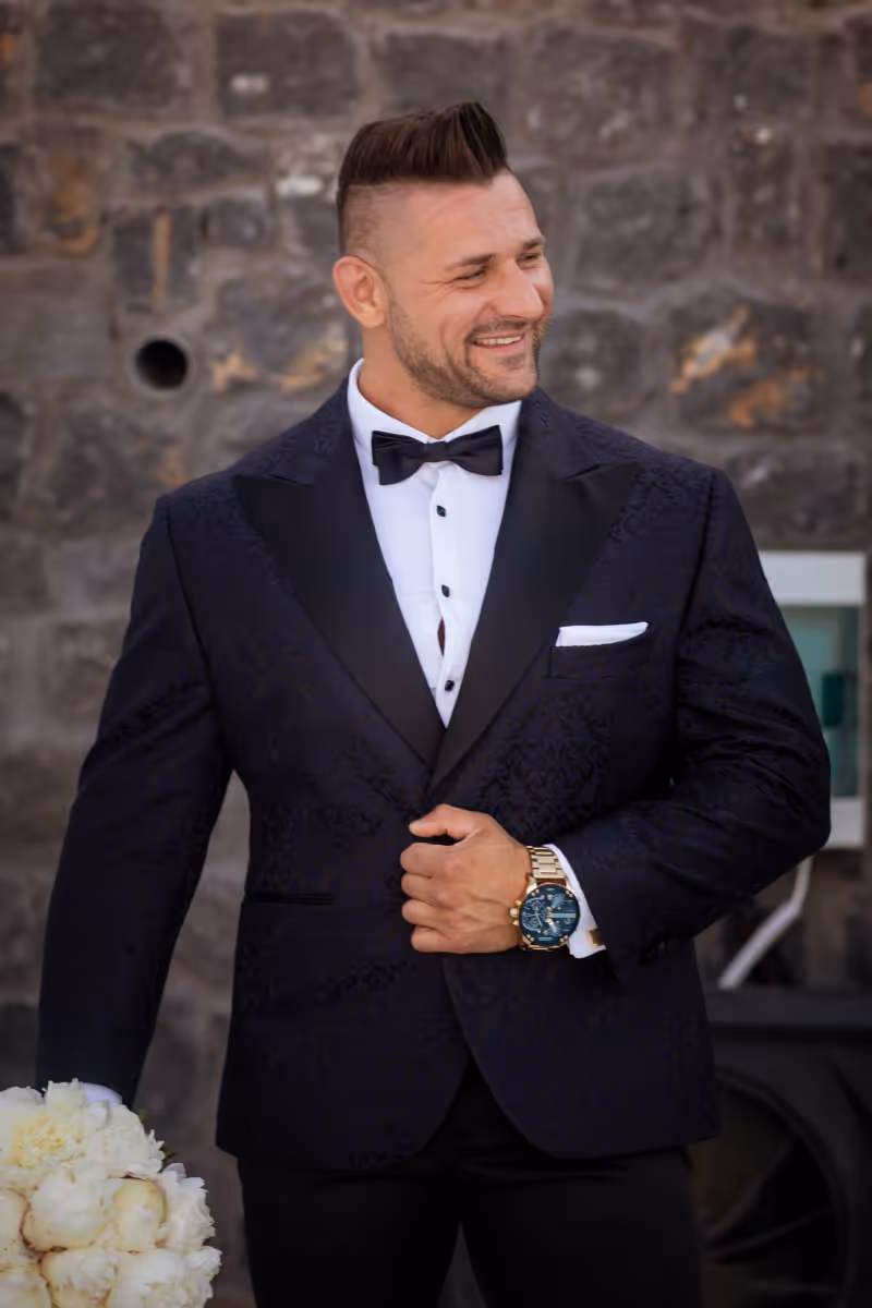 Wedding in Greece. Santorini. A shot of the groom in a wedding suit