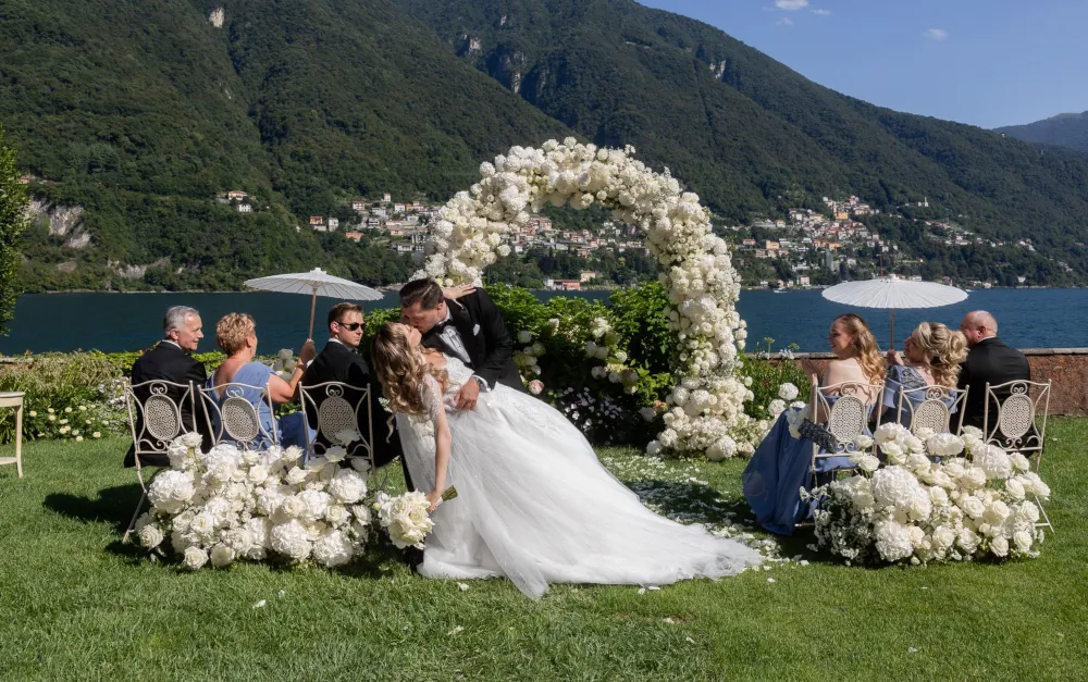 Wedding in Italy. Lake Como. Shot of the bride and groom during the wedding ceremony by the lake.