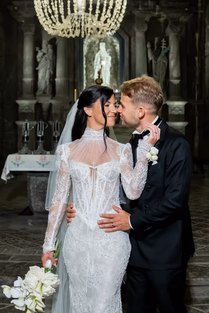 Wedding in Wieliczka Salt Mine (Poland). Young couple looking at each other after the wedding ceremony.